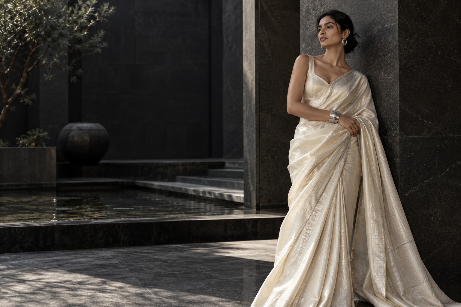 Contemporary ivory sari styled with architectural simplicity